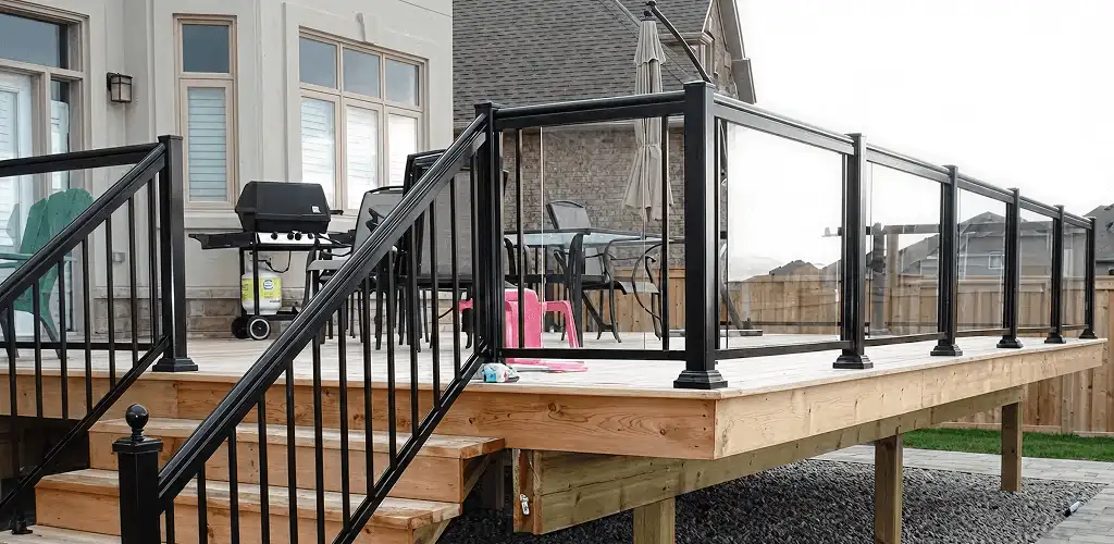 Handrail installation on a deck staircase for safety and code compliance in Houston, TX